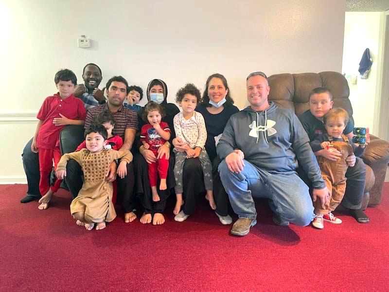 Refugee family with a volunteer
